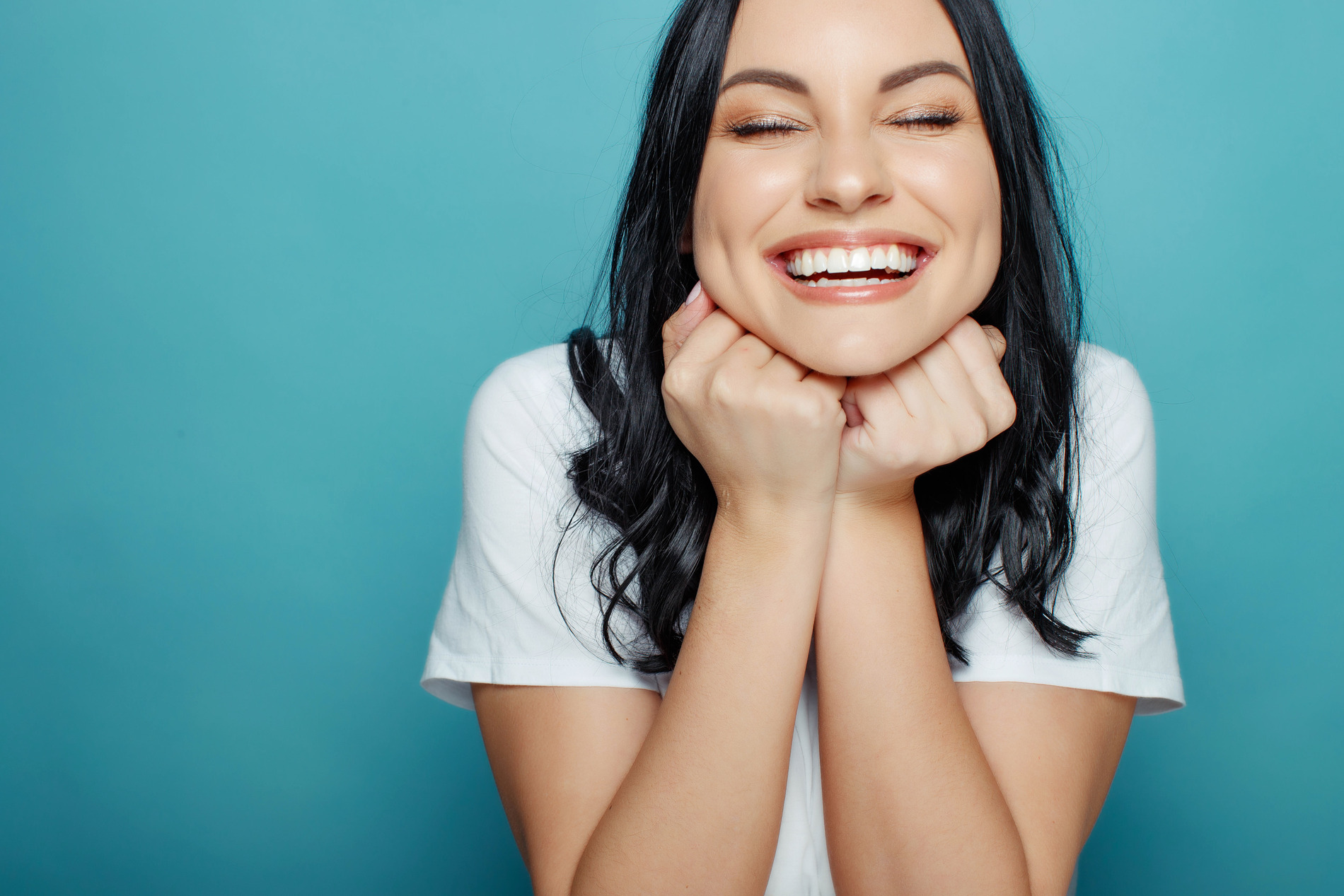 AdobeStock_261506995 v2 Woman showing off her beautiful jaw after orthognathic surgery in New york NY