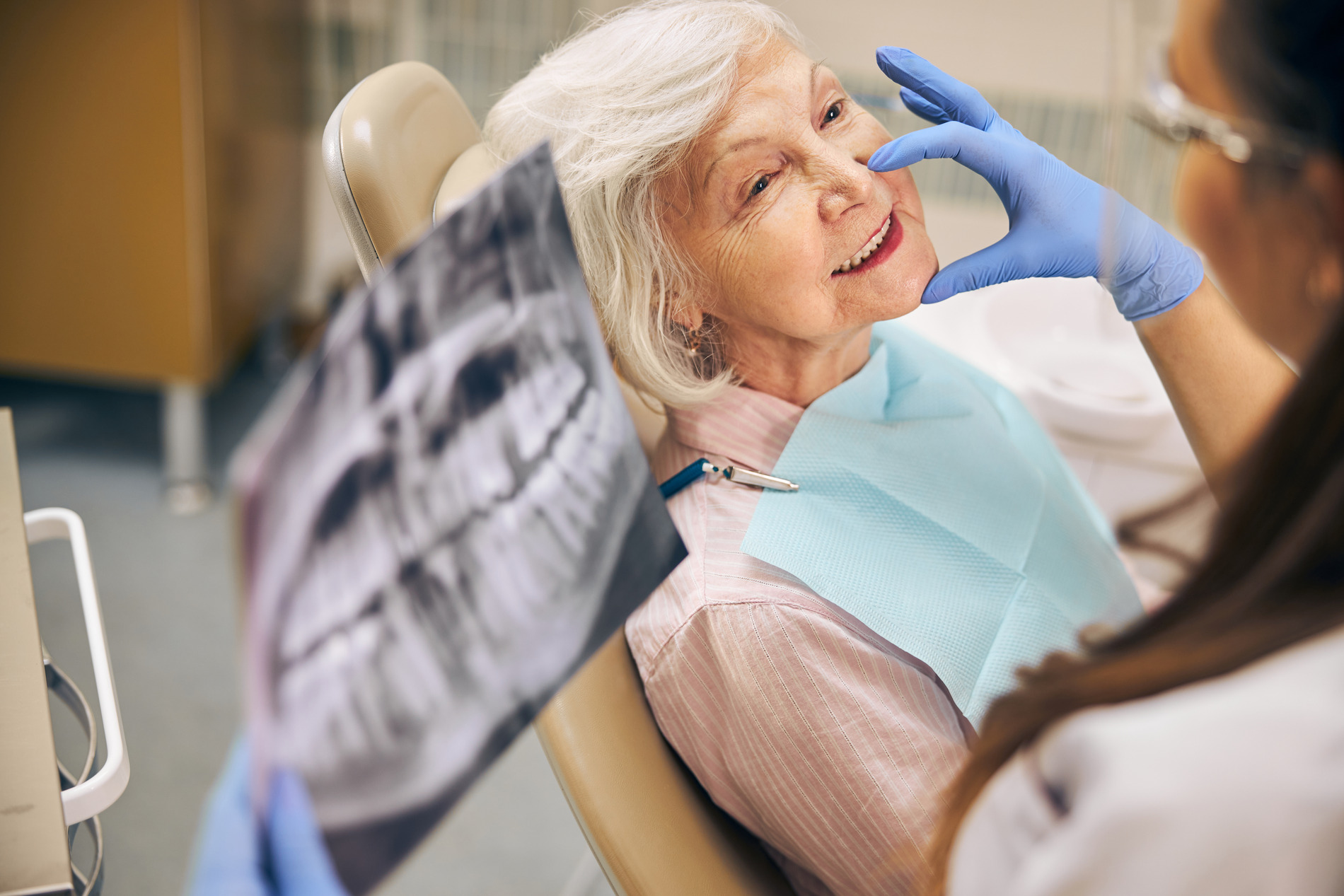 Woman at her orthognathic surgery with dr. Cooperman and Dr. Romao